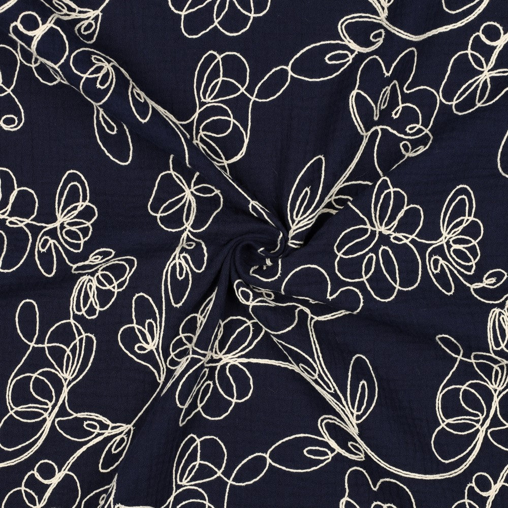 
                  
                    Donkerblauwe double gauze met lichte geborduurde bloemen, double gauze
                  
                
