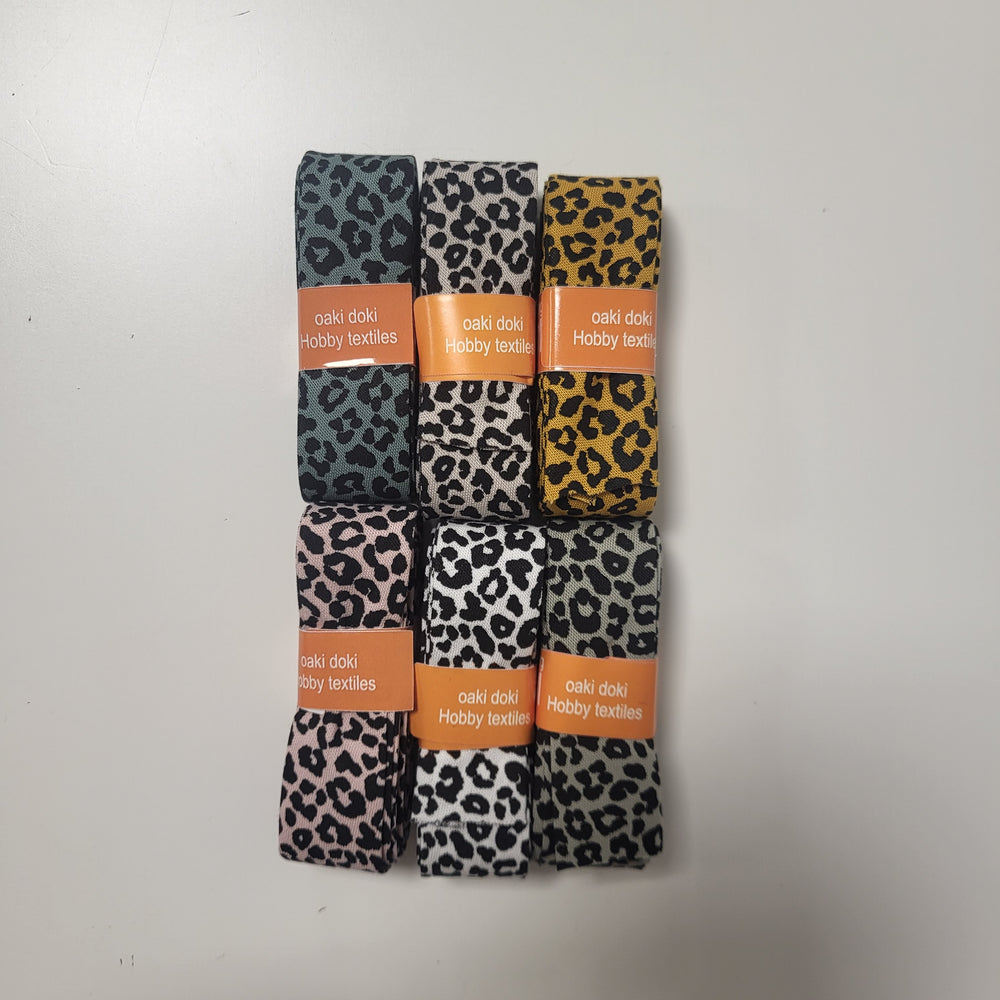Oaki Doki, biaisband met panterprint